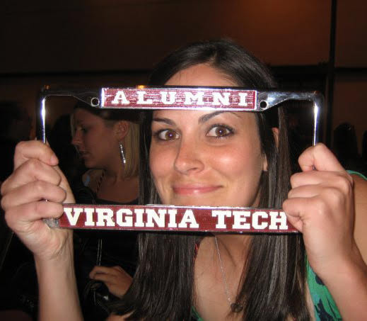 A Virginia Tech alumna holding an Alumni Virginia Tech frame at a chapter gathering