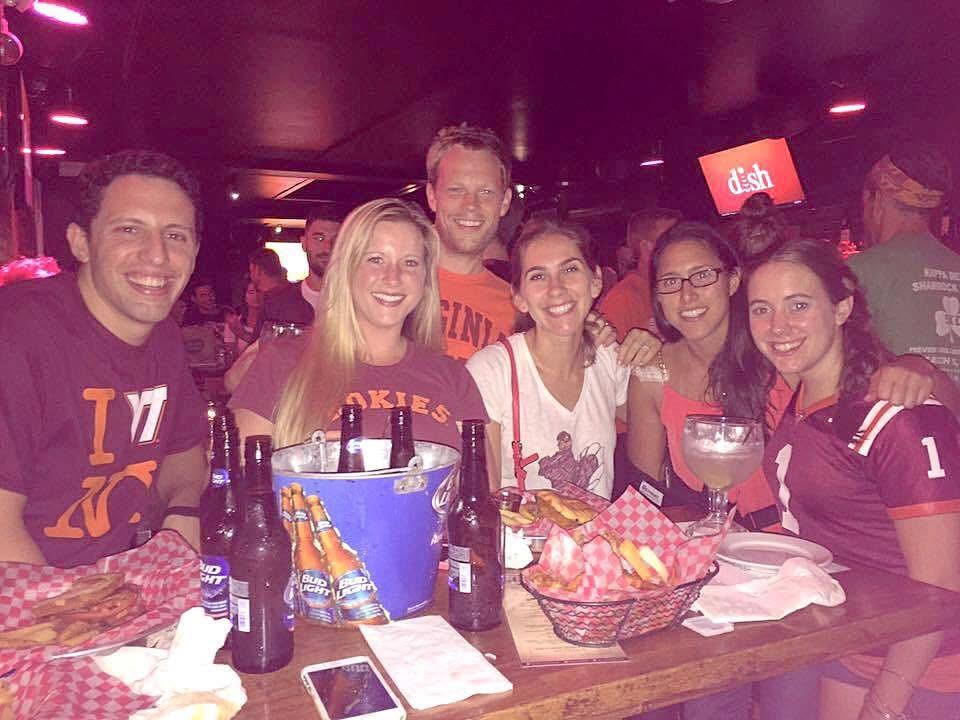 Virginia Tech alumni gathered around a table on game day in New York
