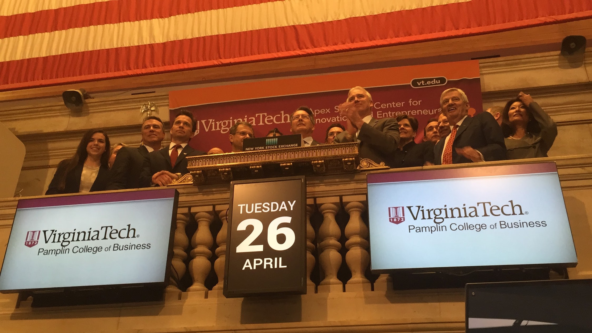 Virginia Tech and Pamplin College of Business representatives on the New York Stock Exchange balcony