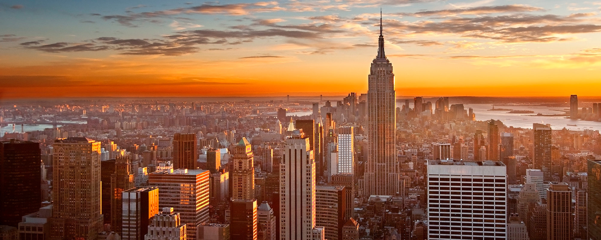 The Empire State Building and Manhattan skyline at sunset