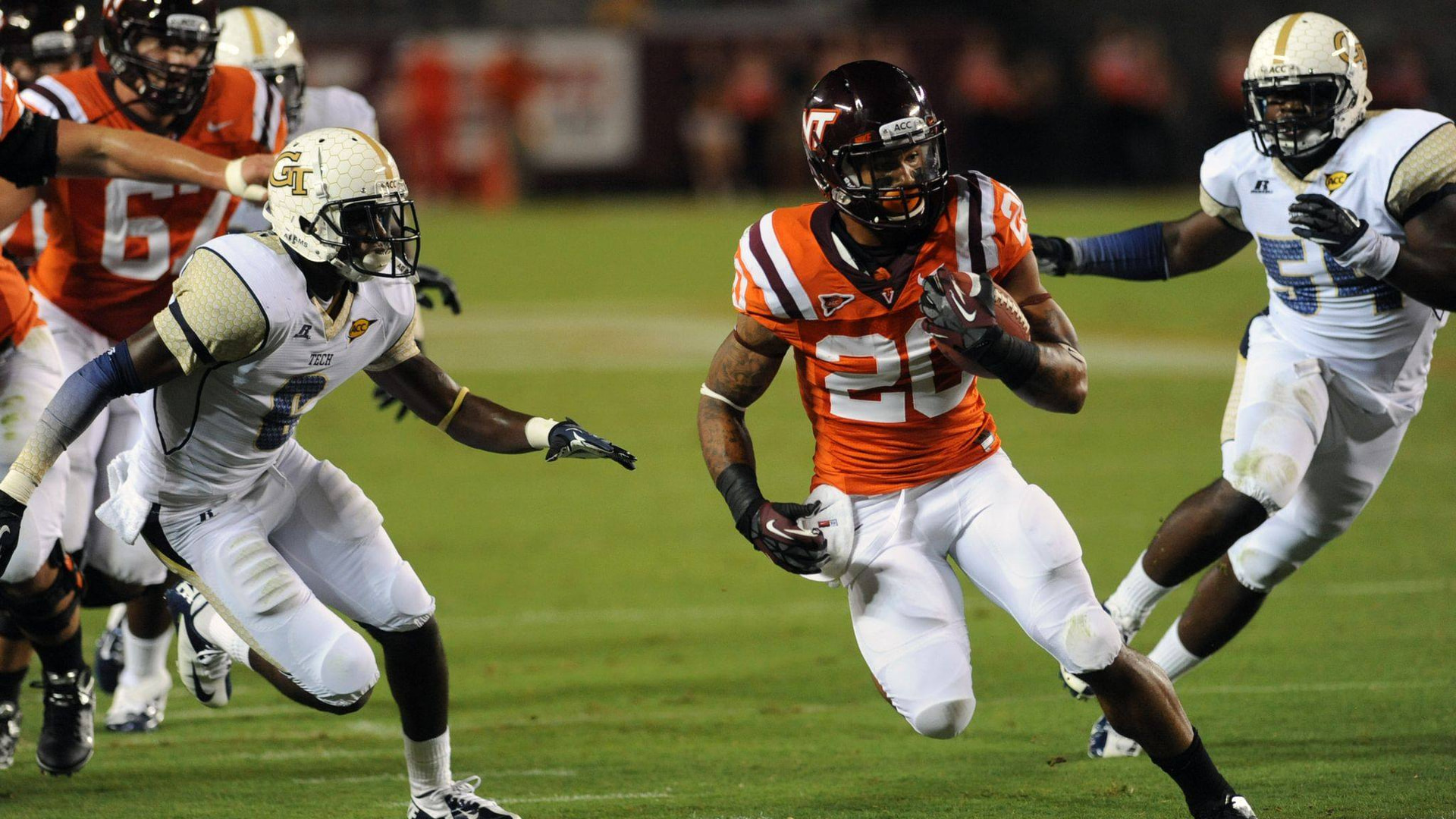 A Virginia Tech football player carrying the ball against Georgia Tech