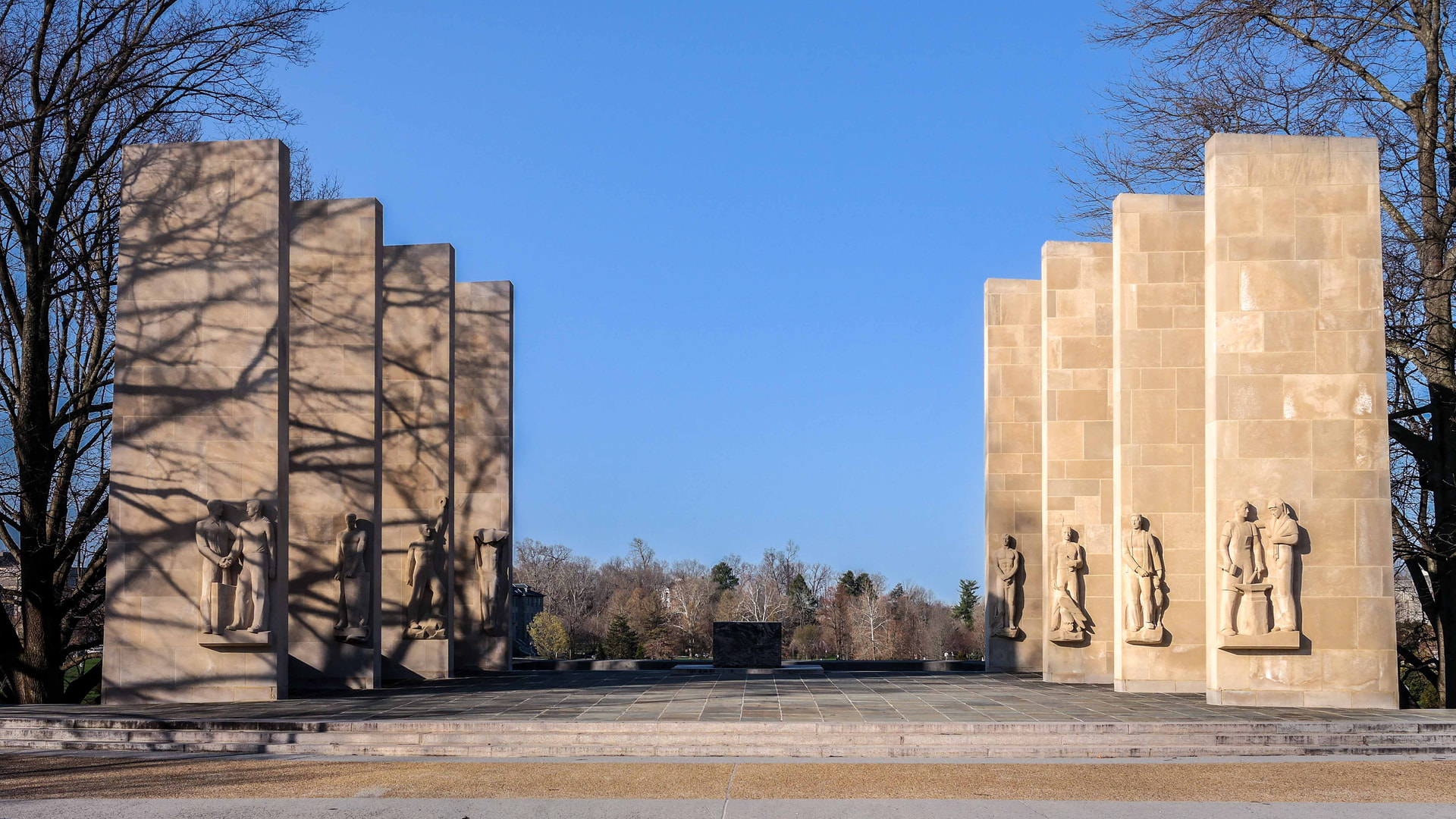 The Virginia Tech War Memorial in Blacksburg under a blue sky