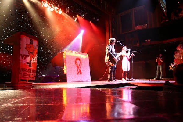 A band performing beneath stage lights at Webster Hall