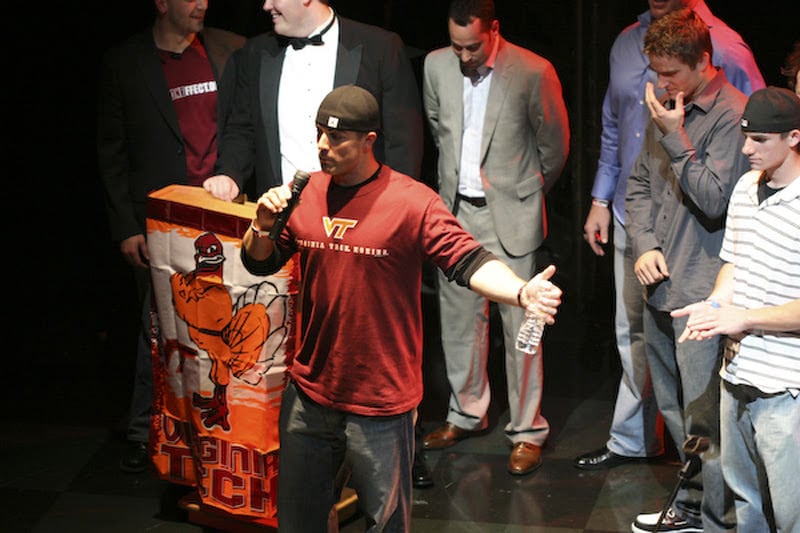A person standing onstage during Maroon Effect